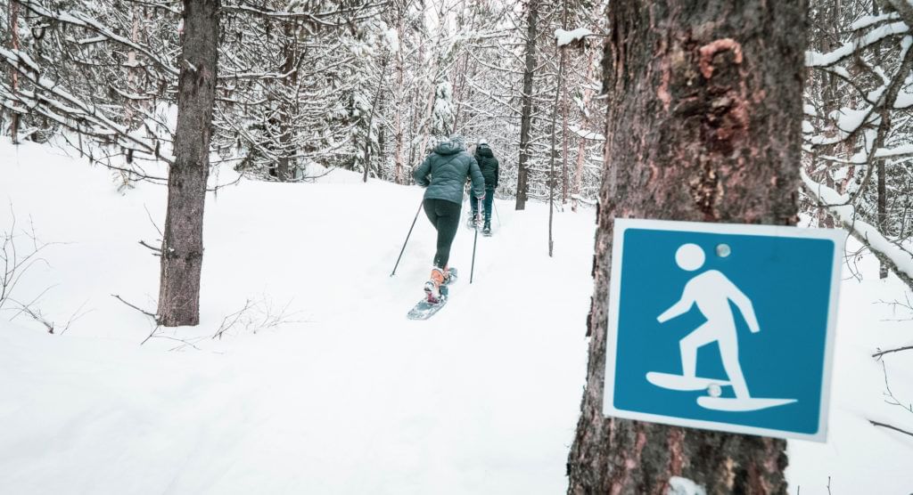 Two people snowshoeing at Telemark in West Kelowna. 