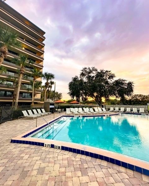 A seasonally heated swimming pool at Rosen Inn at Pointe Orlando, a family-friendly hotel on International Drive in Orlando.