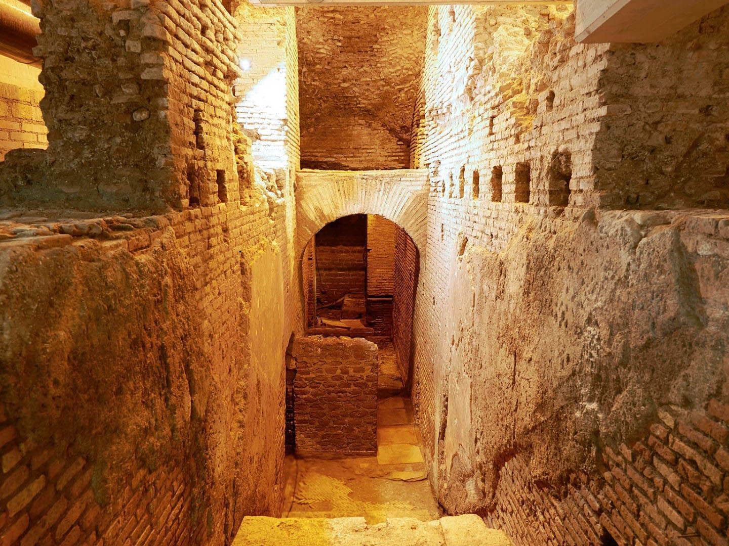 Vicus Caprarius with arched ceilings and exposed brick walls near The Glam Hotel