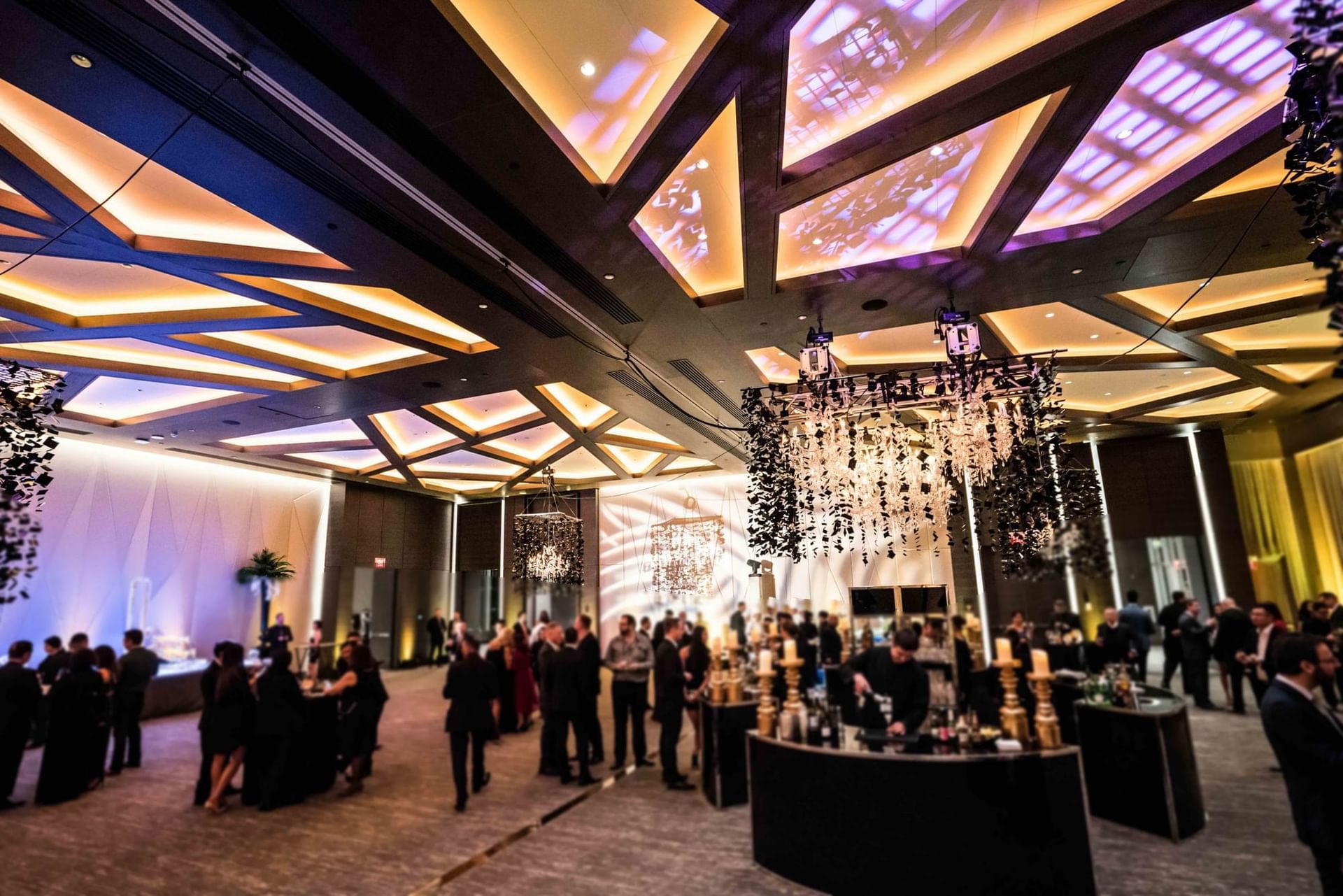 Paradox Hotel Vancouver Grand Ballroom event space with many guests, elegant decor, and a sophisticated ambiance.