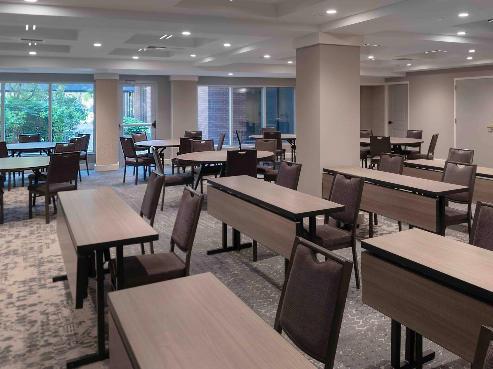 Table arrangement in Williams Room with carpeted floors at Portland Harbor Hotel