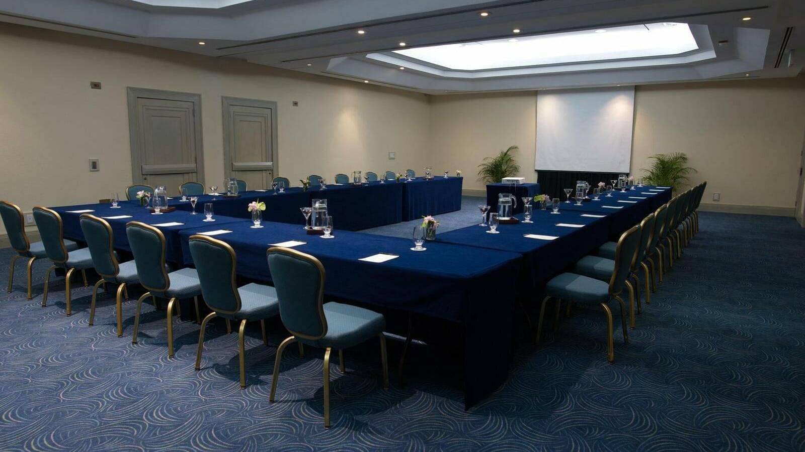 U-shaped table setup in meeting room at Grand Fiesta Americana