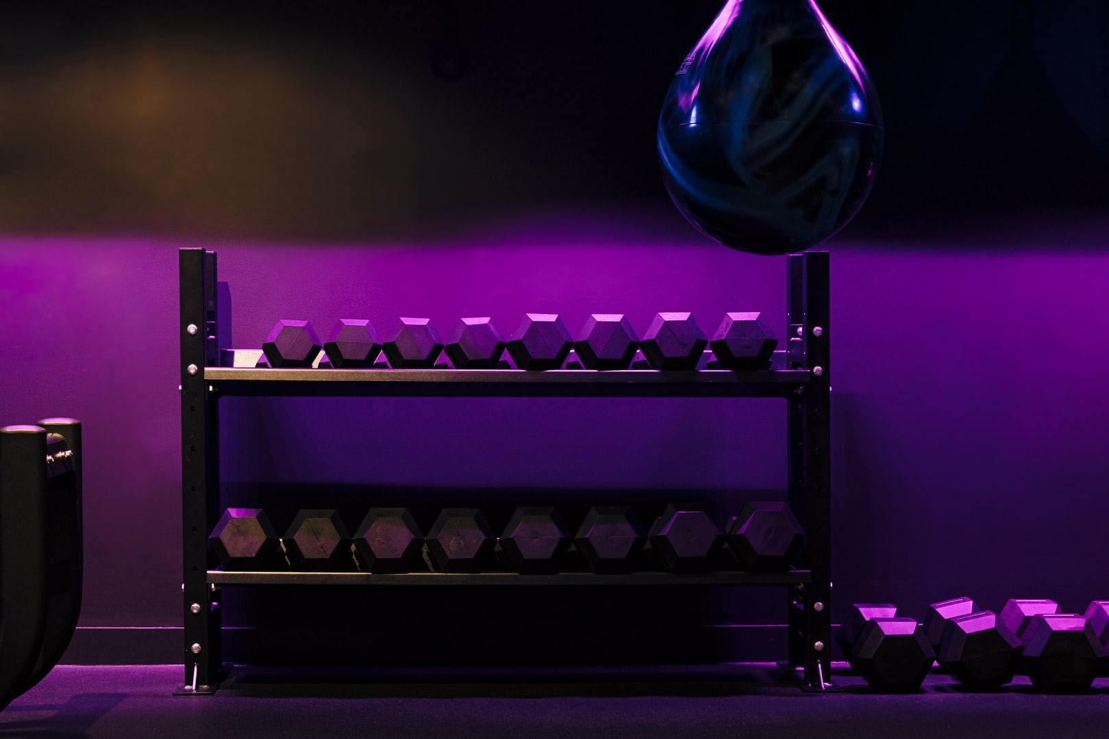 Gym interior with purple lights at Pullman Melbourne CBD