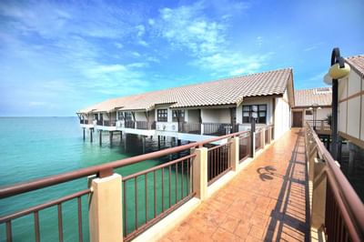Overwater chalets with private balconies connected by walkway – Lexis Port Dickson
