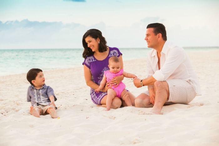 Family enjoying on the beach near The Somerset On Grace Bay