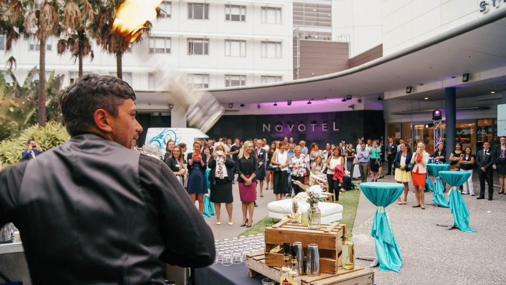 Bartender performing a fire show for guests at the Boulevard Brasserie & Bar event in Novotel Sydney Olympic Park