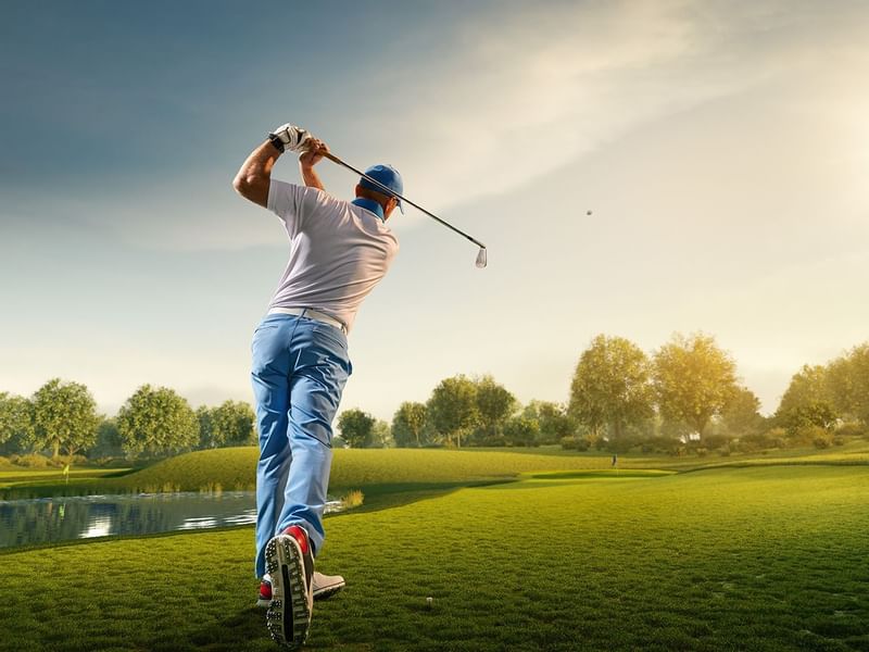 A man playing golf at FA Puerto Vallarta All Inclusive & Spa