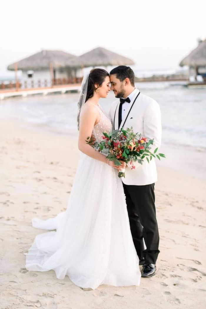 A lovely wedding couple at the beach near Club Hemingway