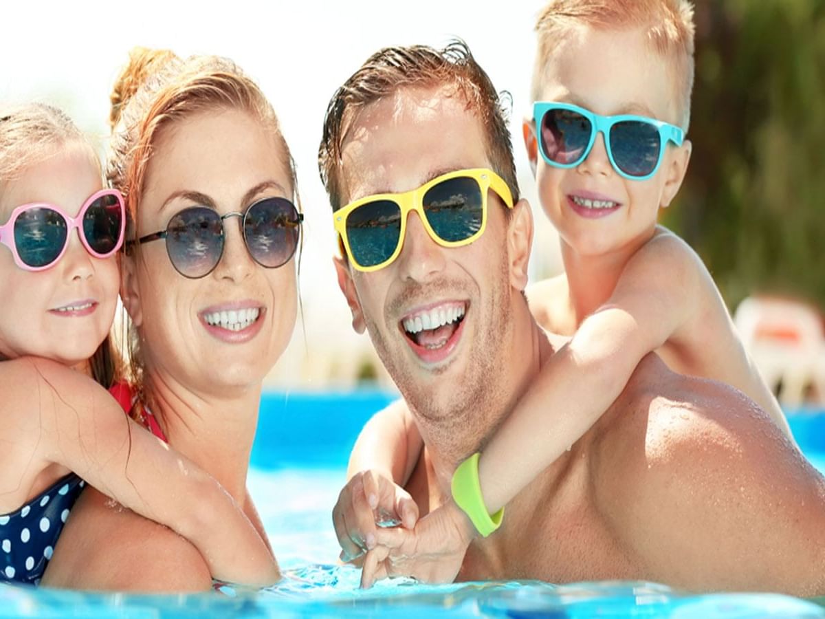 Family enjoying in outdoor pool, Rosen Inn at Pointe Orlando