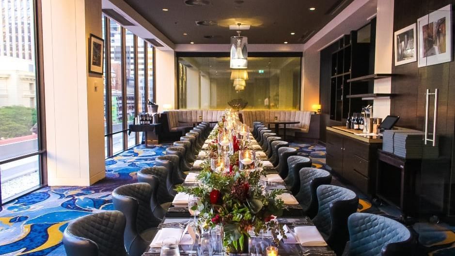 Dining area with plush seating and carpeted floors in Prive at Sofitel Brisbane Central