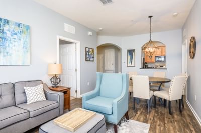 a chair, couch, and table in a living area