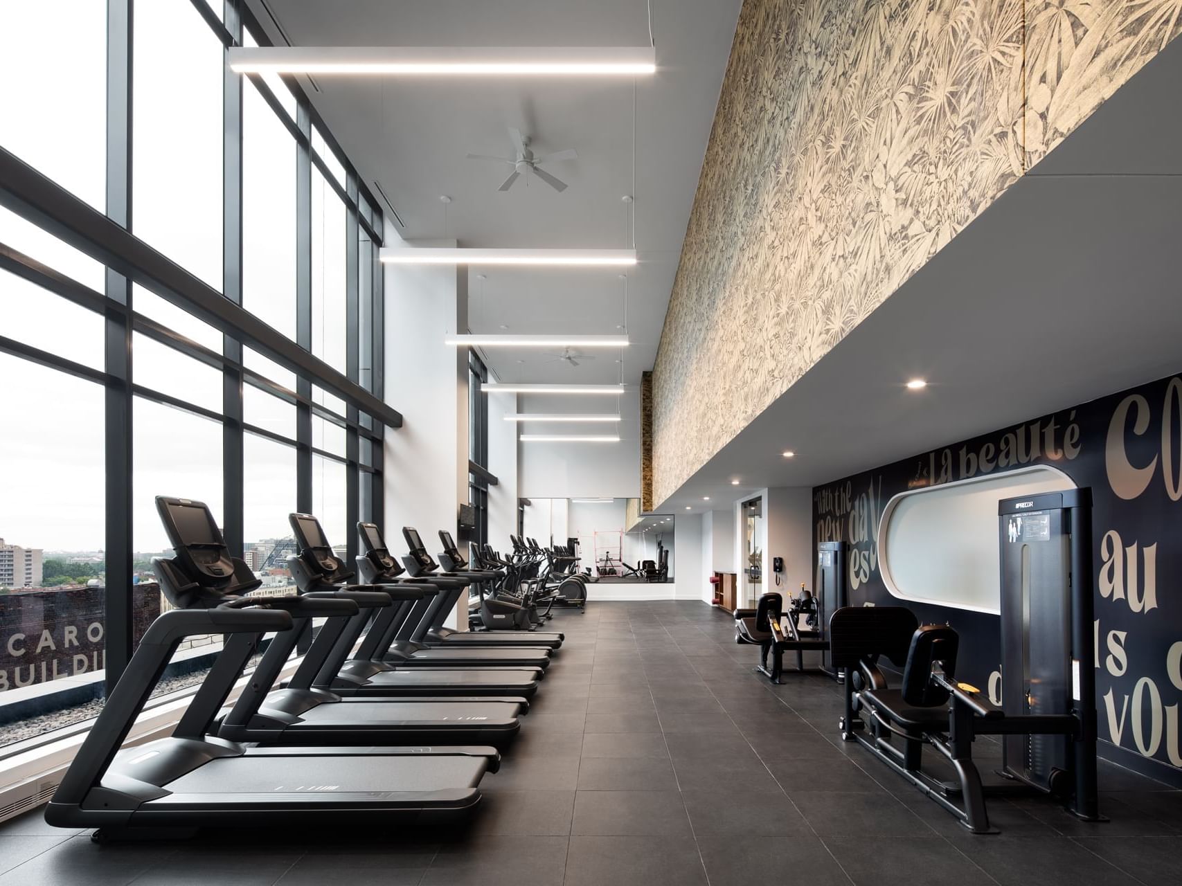 Exercise machines in Gymnasium at Honeyrose Hotel