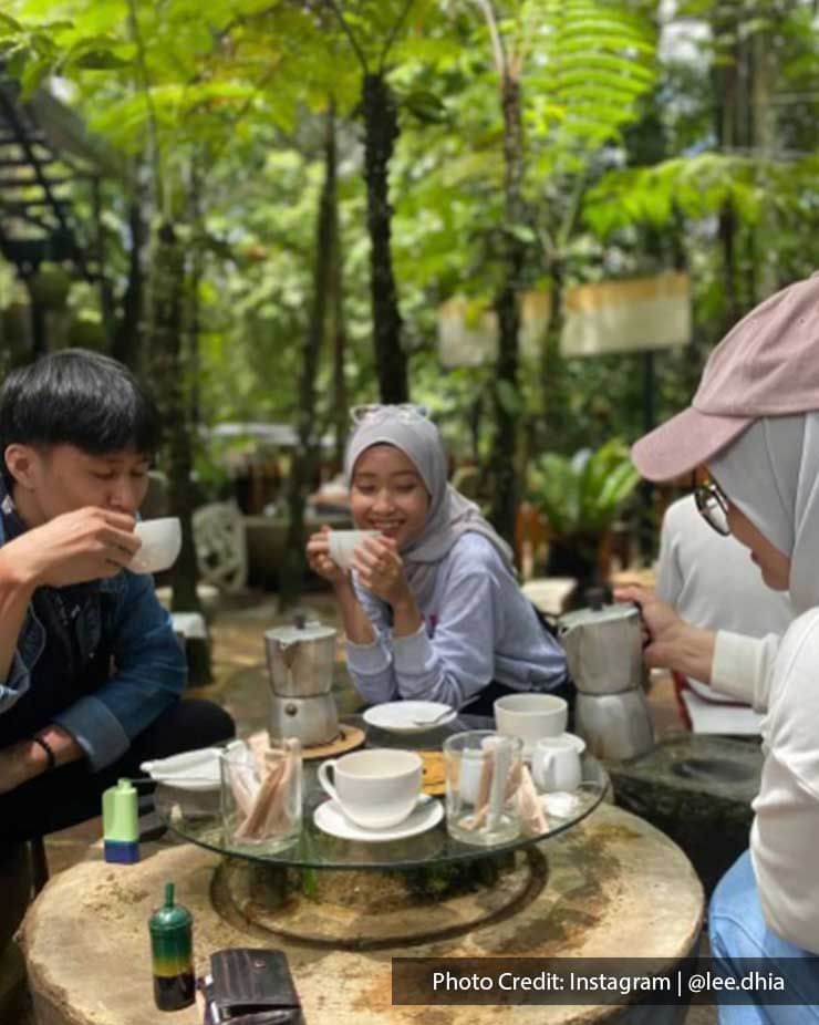 Two women and one man were savoring the delicious dishes at Kopi Hutan - Lexis Suites Penang
