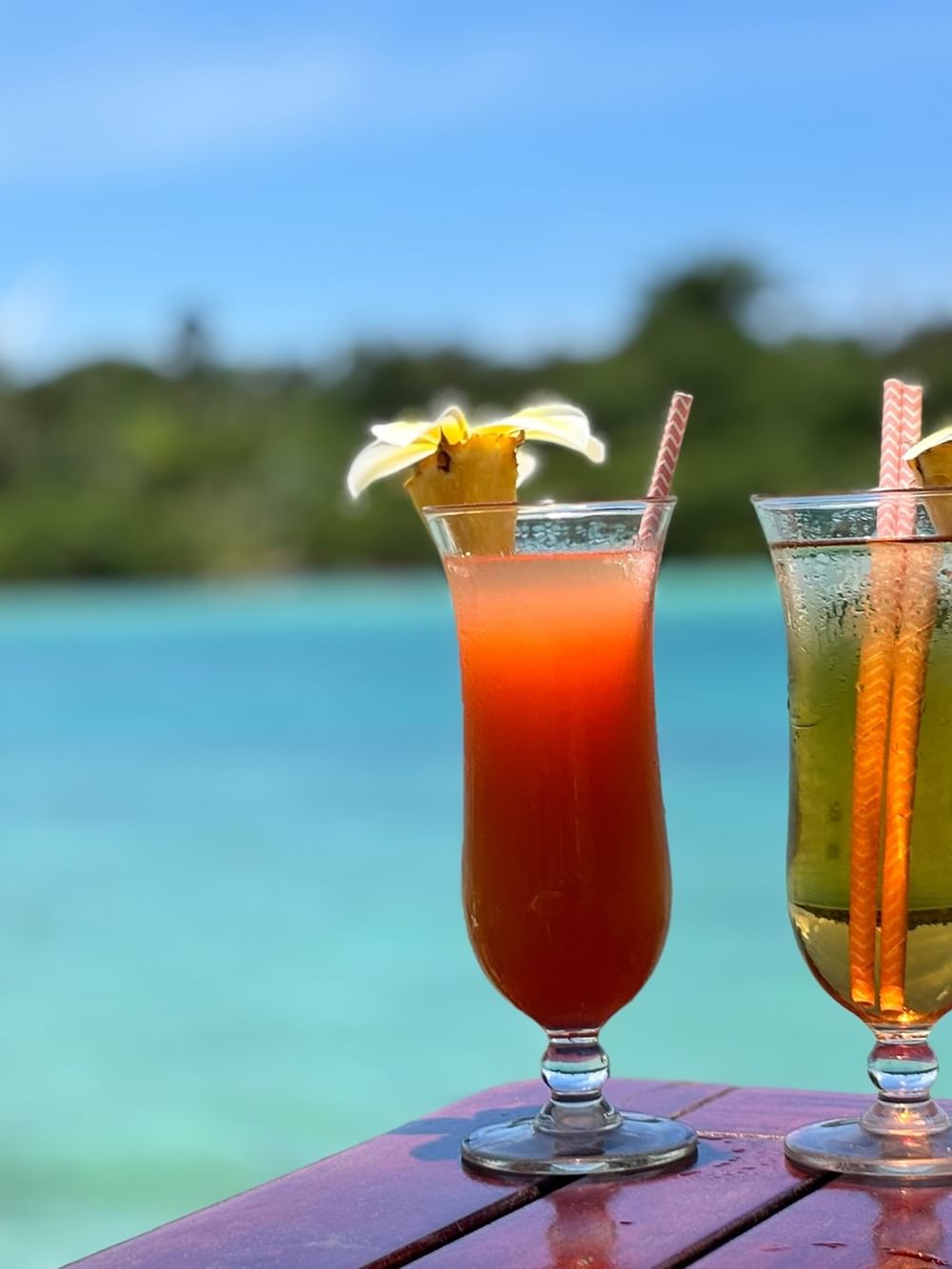 Two tropical cocktails with ocean view at Warwick Le Lagon Vanuatu in Efate.
