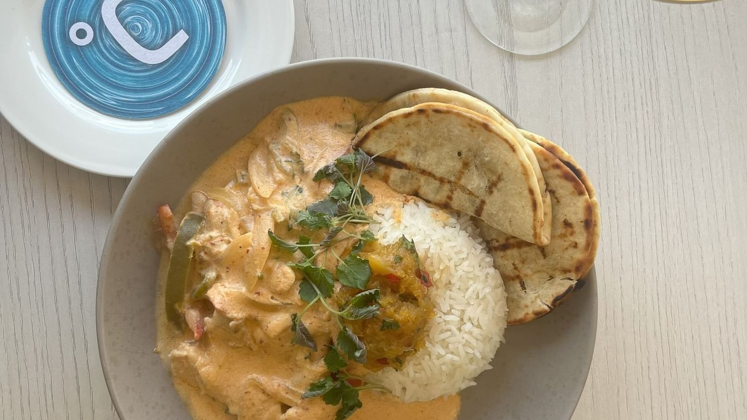 Creamy curry and rice served in a bowl at Celsius Restaurant & Bar by Mercure Hotel Townsville