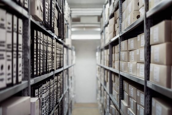 stacked boxes on shelves