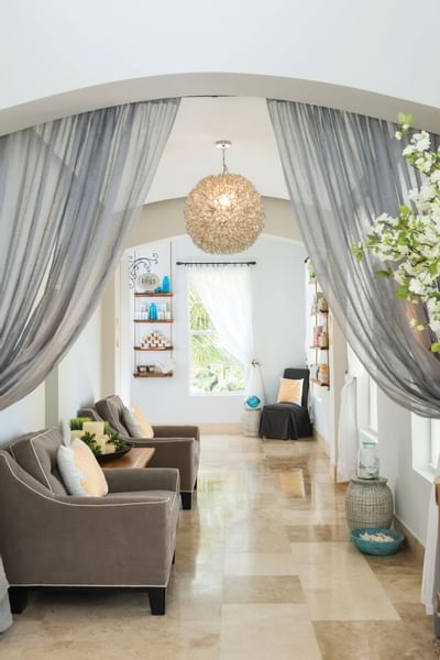 Lobby area with sofa in Drift spa at Windsong Resort On The Reef