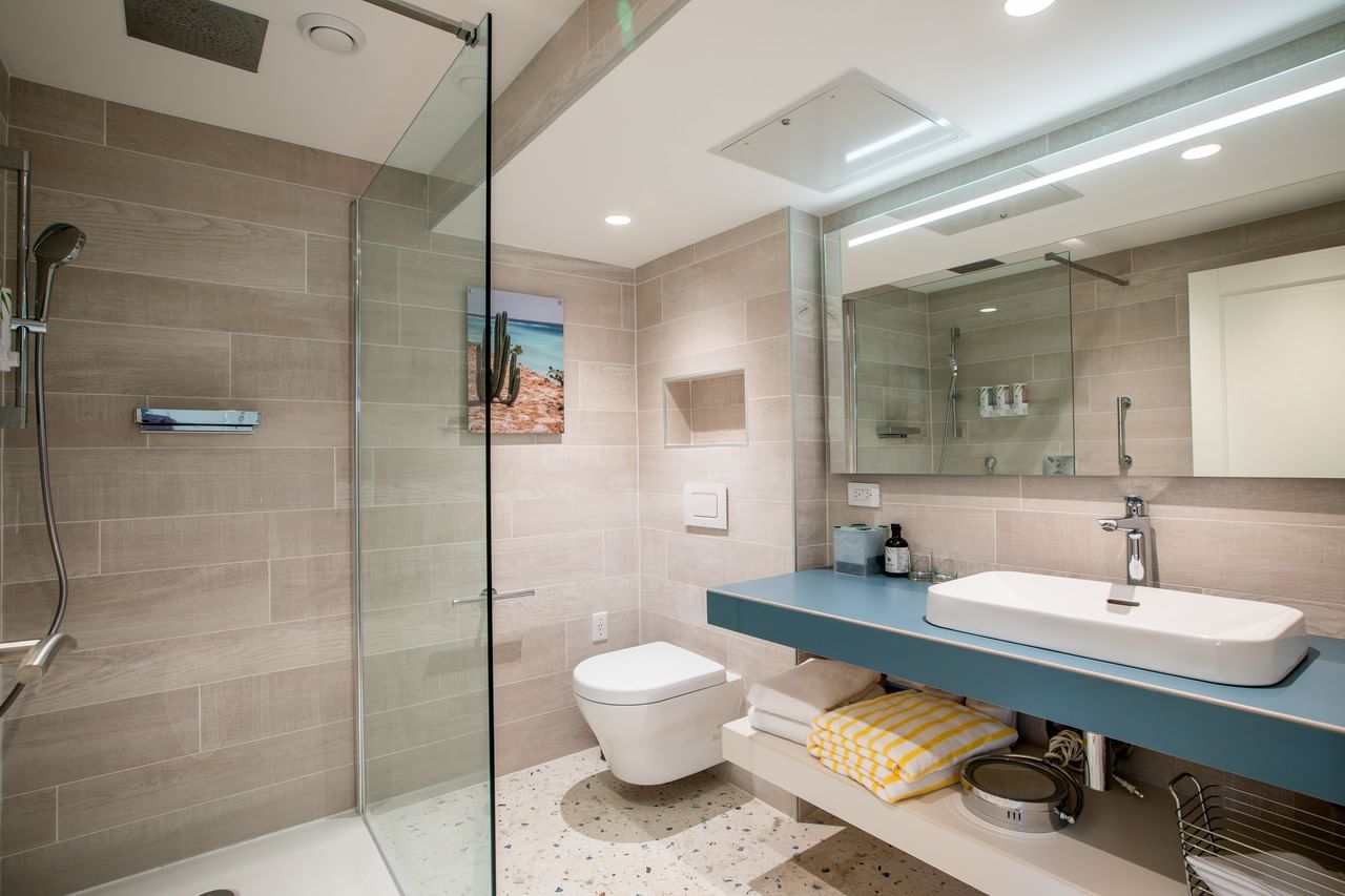 Bathtub & shower with vanity in Honeymoon Suite at Amsterdam Manor Beach Resort