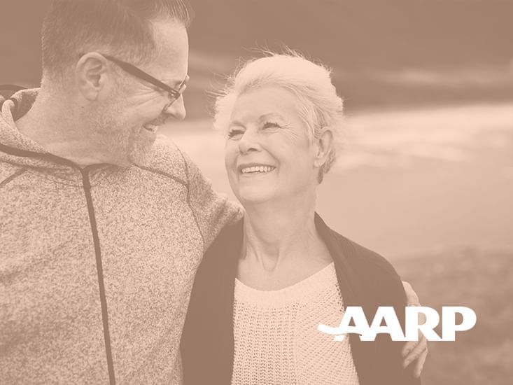 Elderly couple in AARP Member Discount Banner at Plymouth Hotel