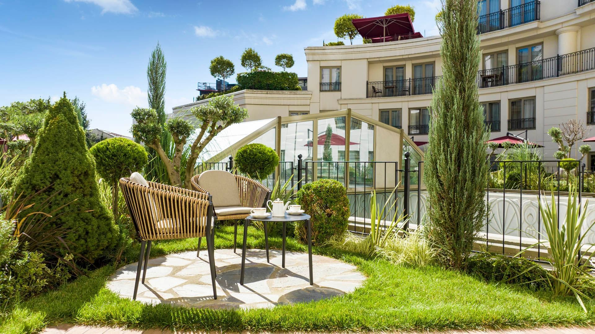 Outdoor coffee table arranged by the Studio Garden Terrace Suite at CVK Park Prestige Suites Istanbul