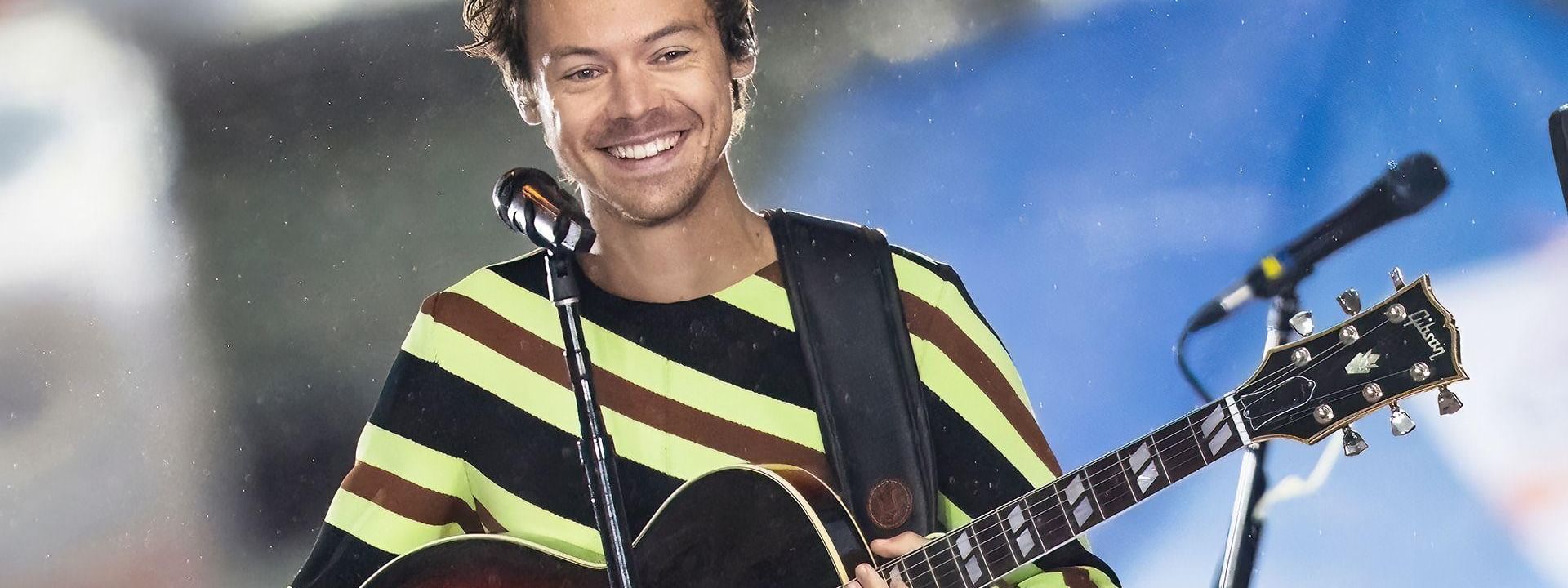 Smiling Harry Styles with guitar on stage at Harry Styles – Together, Together Tour 2026.