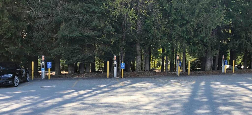 EV charging stations surrounded by trees at Whistler’s Lot 4