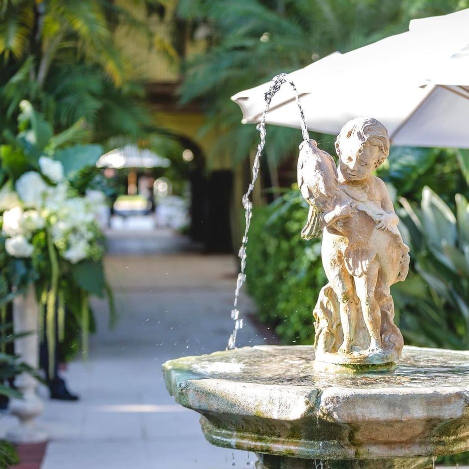 A closeup of Cupid Boy And Fish Fountain at Brazilian Court