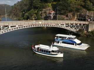 Two boats sailing under Paterson bridge in Tamar River near Hotel Grand Chancellor Launceston