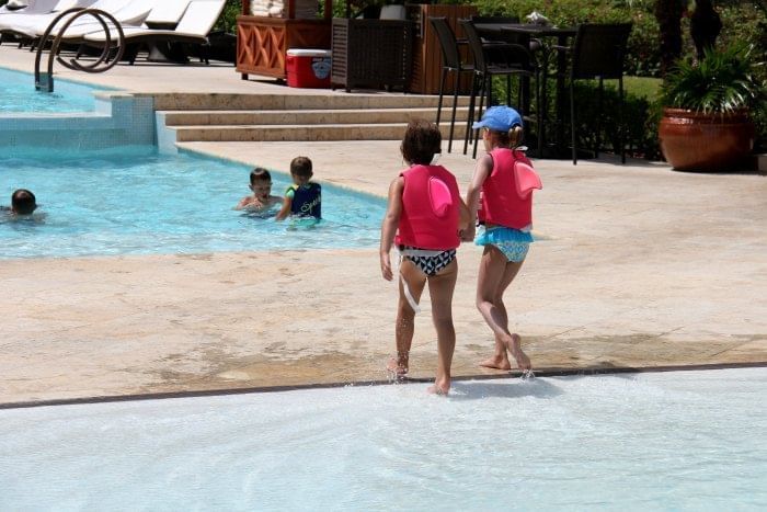 Kids enjoying the pool at The Somerset On Grace Bay