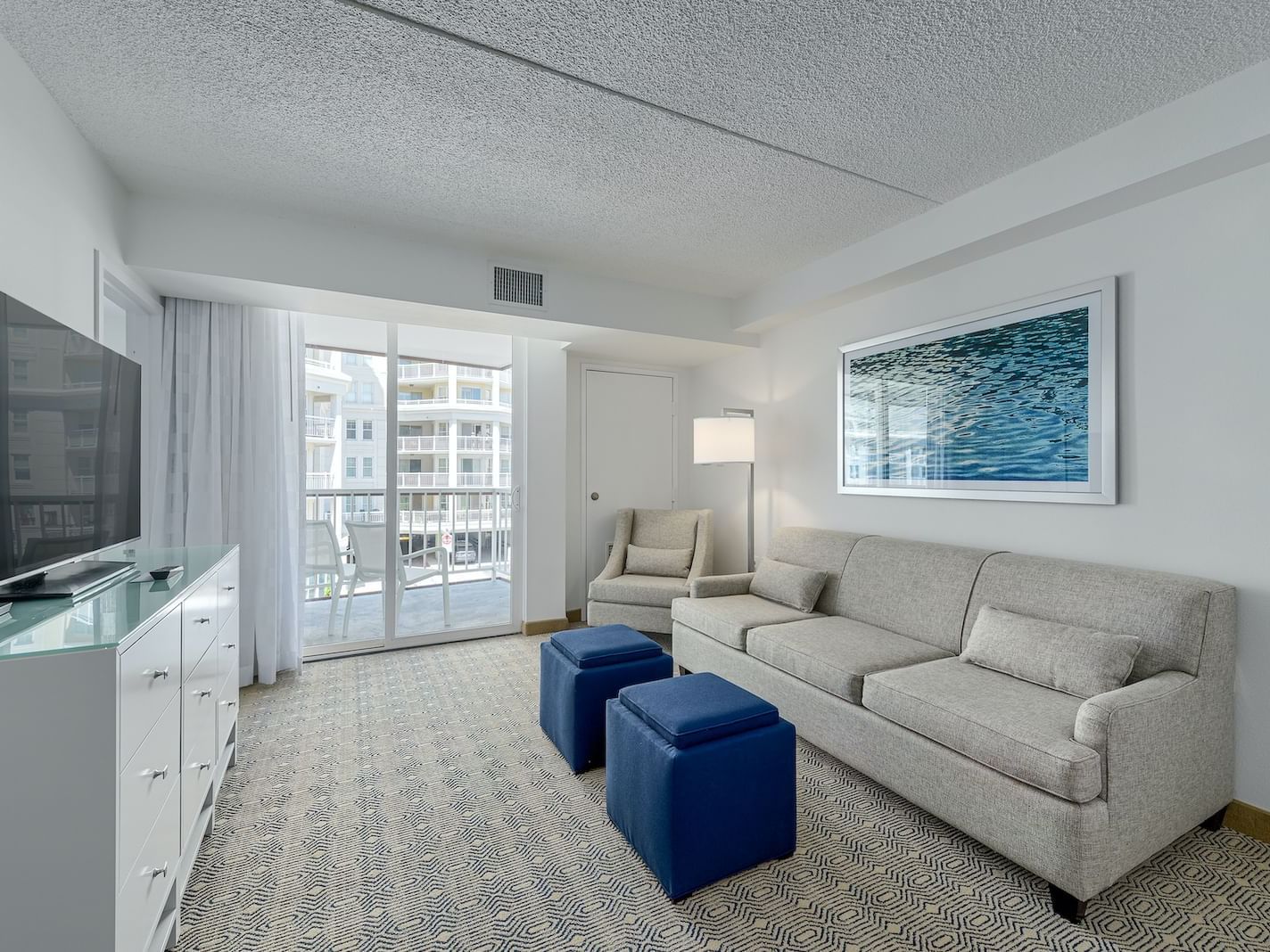 Living room in Premium King Suite at ICONA Diamond Beach Resort