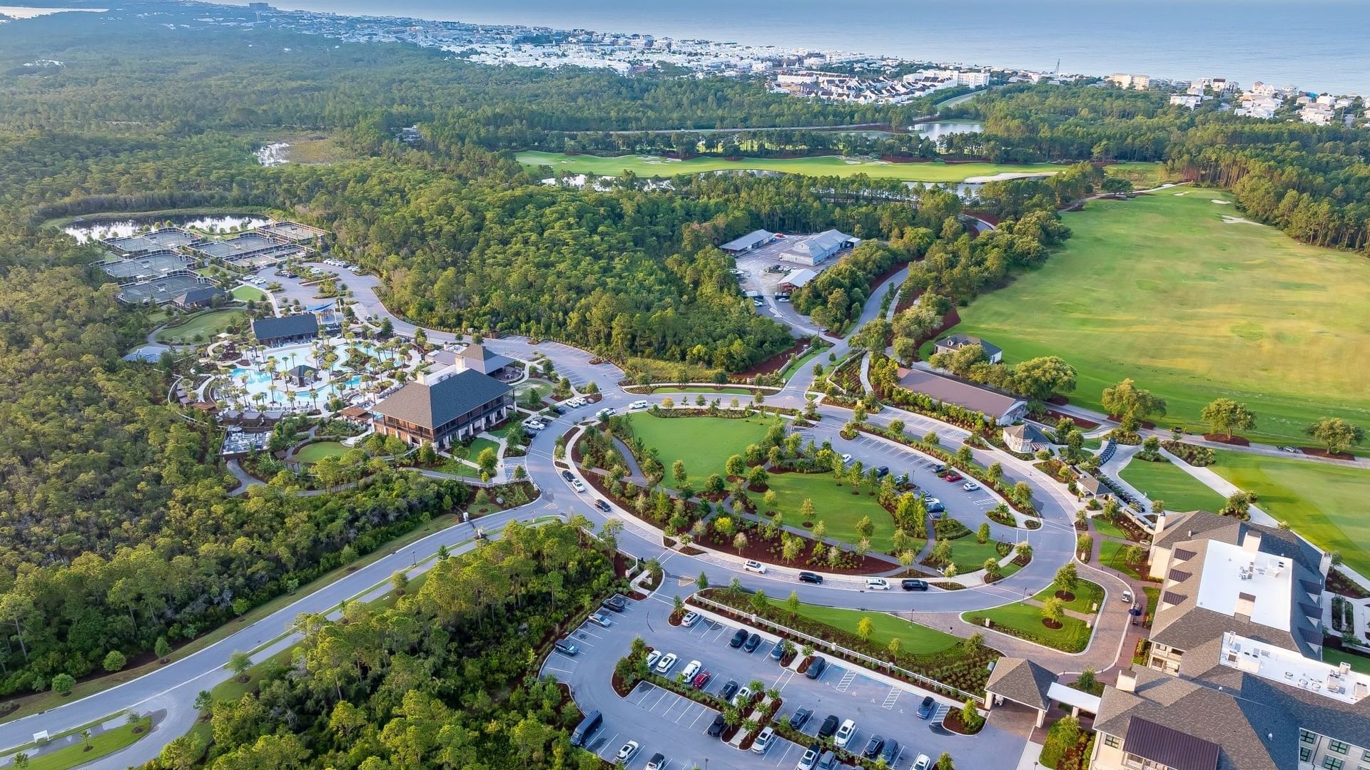 Aerial view of Fairway Park surrounded by lush greenery and golf courses at Camp Creek Inn in Inlet Beach.