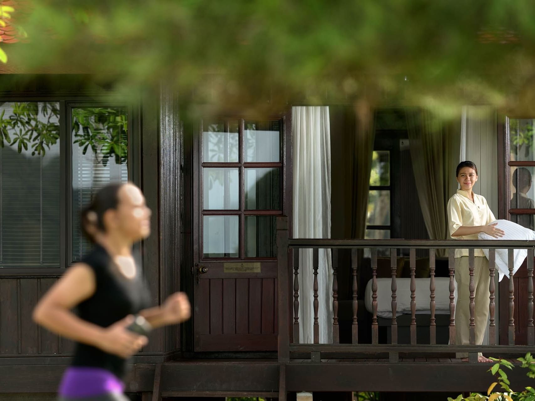 Housekeeper in a Room balcony at Pelangi Beach Resort & Spa