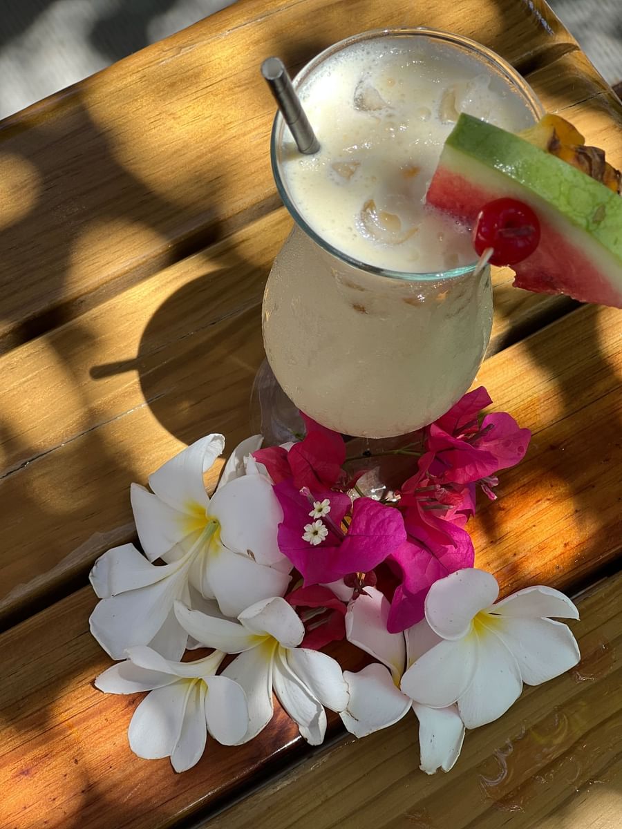 Tropical drink with pineapple and flowers at Warwick Fiji Resort and Spa.