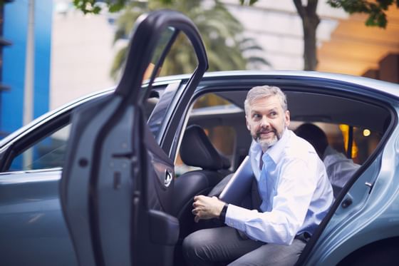 Man in formal wear getting out of car at Sunseeker Resort