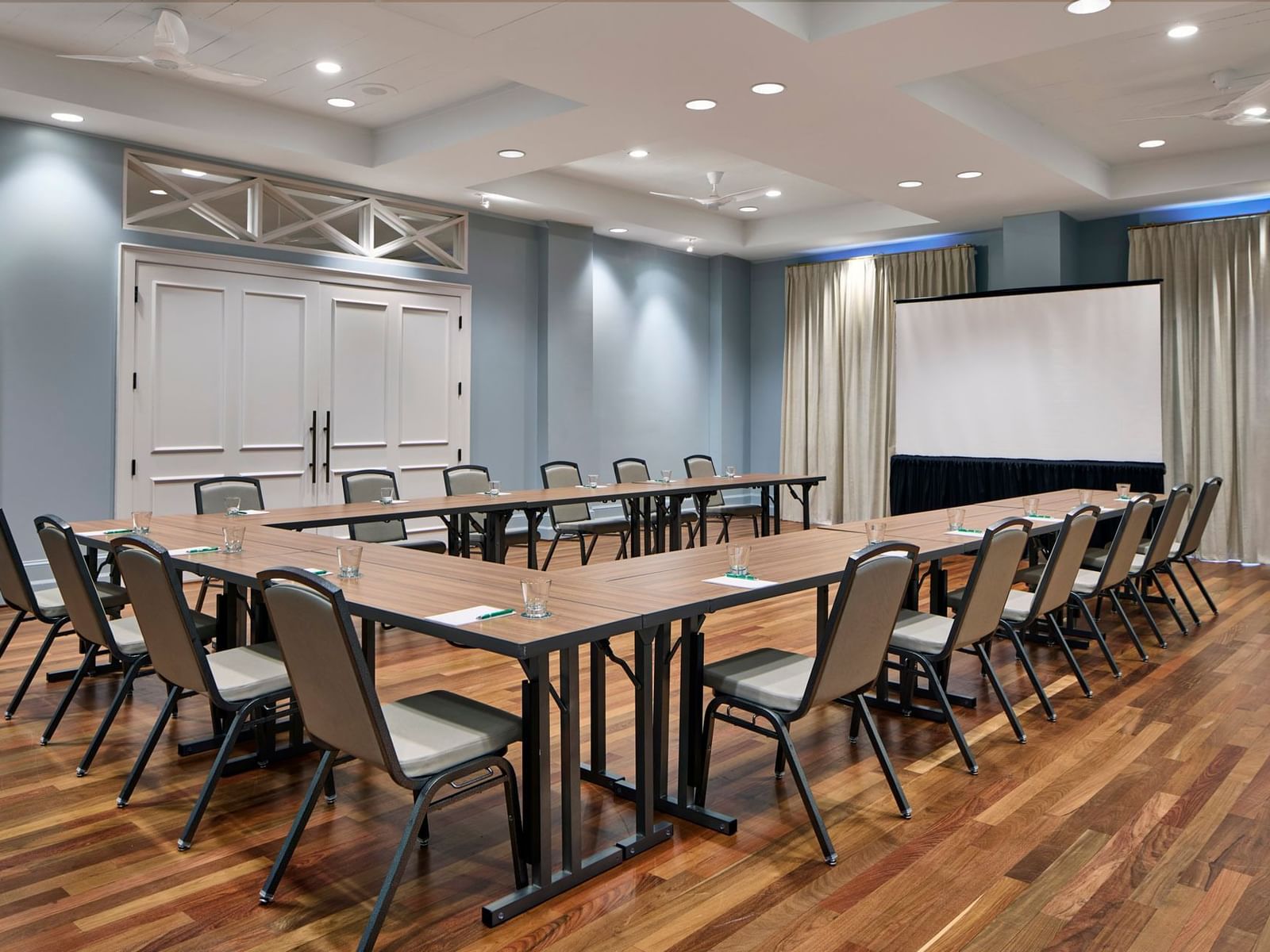 Celebration fl event space of Orange Grove Room with u-shape table setup at Inn at Celebration