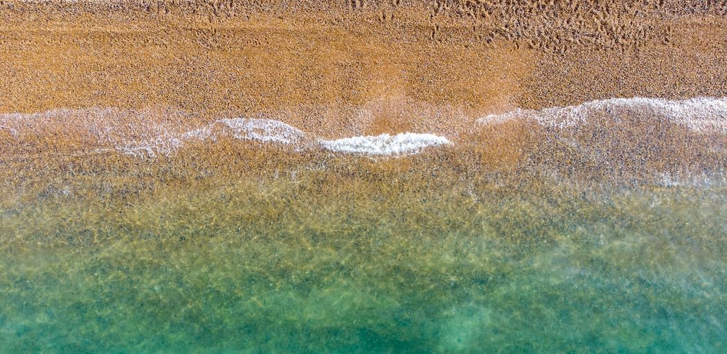Brighton beach tide, sea and sand from above