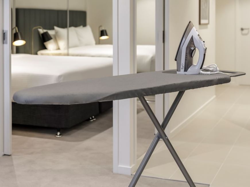 Iron and ironing board in a apartment at Brady Hotels