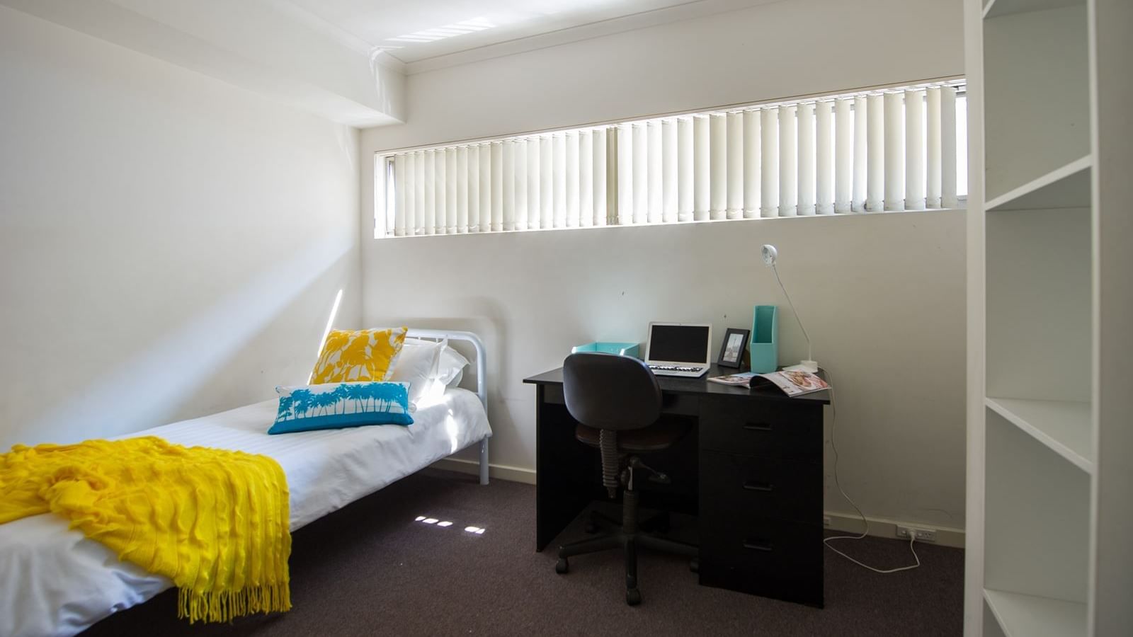 Student Living Edge Apartments – Typical bedroom with single bed, study desk & chair & built in wardrobe