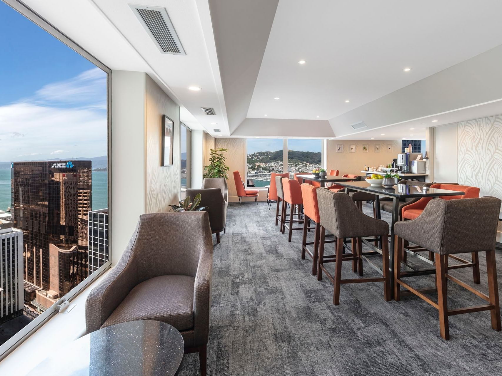 Dining & lounge area with a city view in Harbour Lounge at James Cook Grand Chancellor