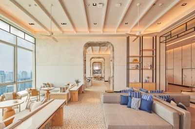 Lounge area with comfy seating & city view in Trattoria@22 at Eastin Grand Hotel Phayathai