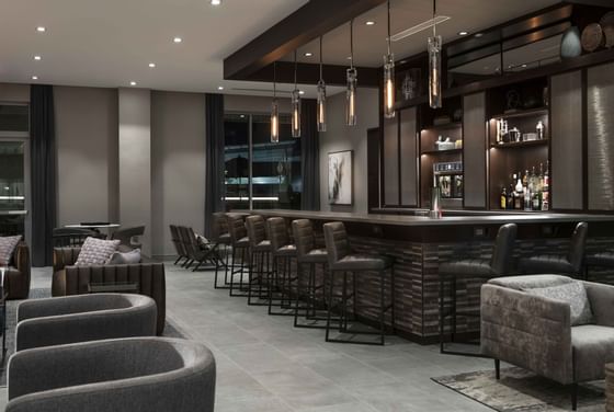 chairs and stools at a bar area