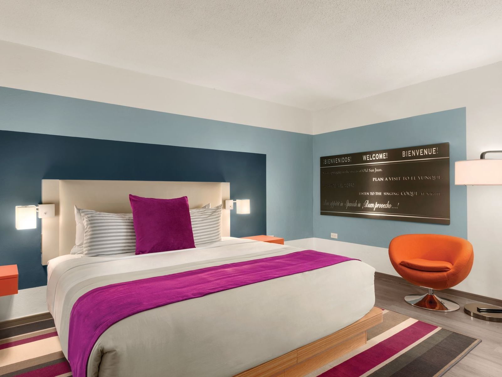 TRYP by Wyndham Isla Verde hotel room with bed and accent chair
