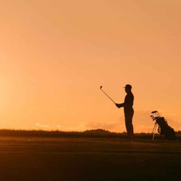 A man playing golf at Falkensteiner Hotels & Residences