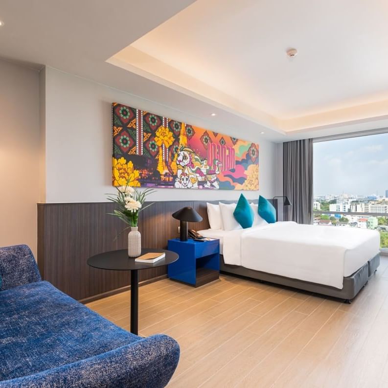 King bed in One Bedroom Apartment at Maitria Hotel Rama 9