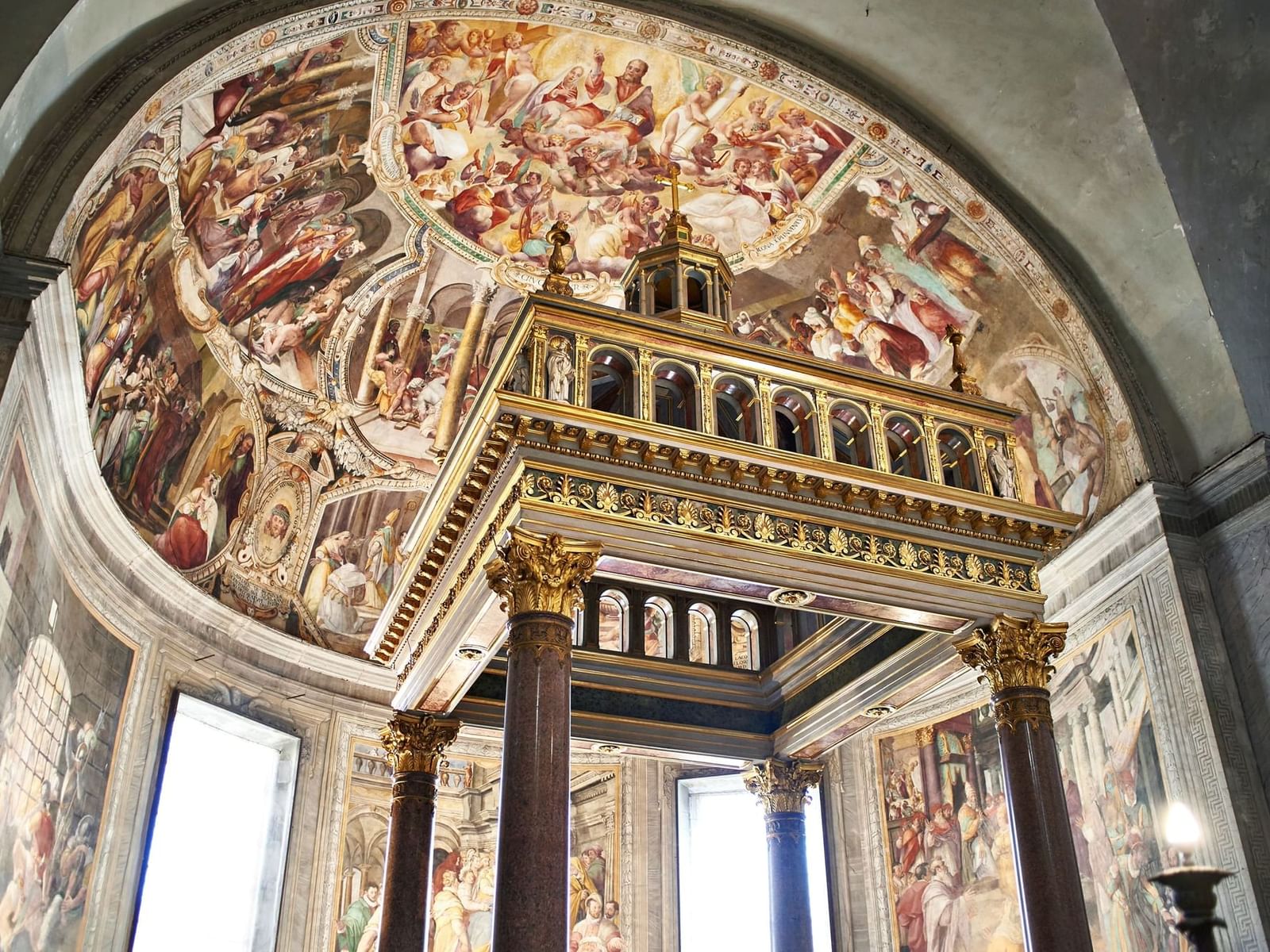 St. Peter's Basilica featuring a grand facade, an iconic dome, and intricate statues near The Glam Hotel
