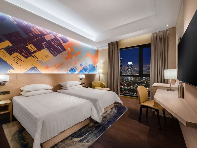 King-size bed and TV in Executive Suites at Sunway Putra Hotel