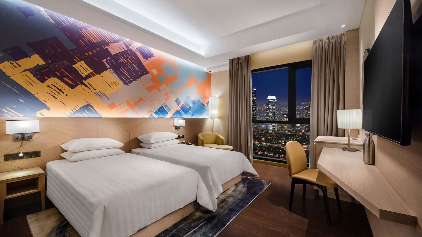 King-size bed and TV in Executive Suites at Sunway Putra Hotel