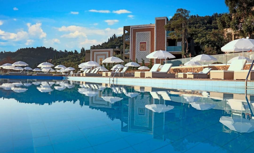 Closeup on the pool with pool chairs at Kairaba Hotel