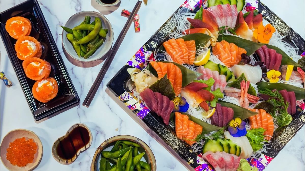 Colorful assortment of sushi and sashimi with soy sauce in Maguro Sushi & Oyster Bar at Crown Hotel Melbourne
