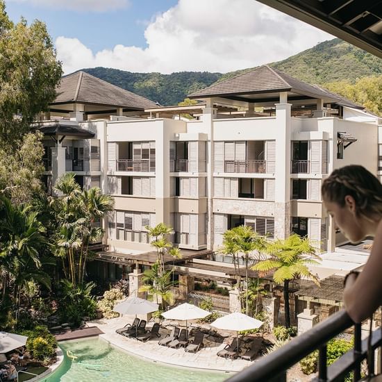 Outdoor pool with exterior of Pullman Palm Cove Sea Resort